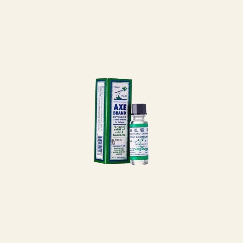Axe Brand Universal Oil 3 ml bottle and retail box on a warm cream background
