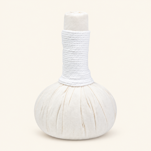 One Poompuksa 200 g Thai herbal compress ball on a plain warm ivory background