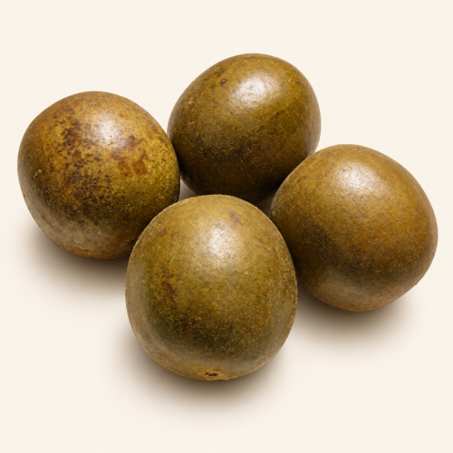 Four whole dried monk fruits on a warm cream background