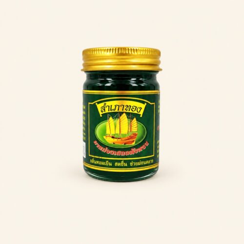 Sampaothong green herbal balm 50 g jar on a warm cream background
