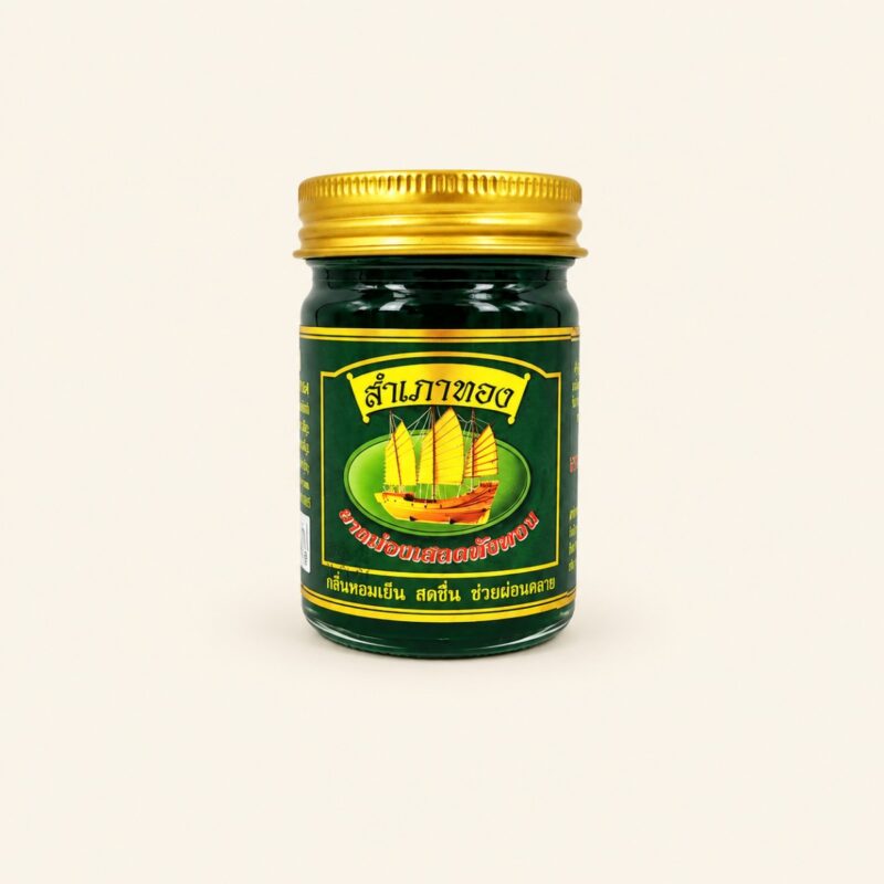 Sampaothong green herbal balm 50 g jar on a warm cream background