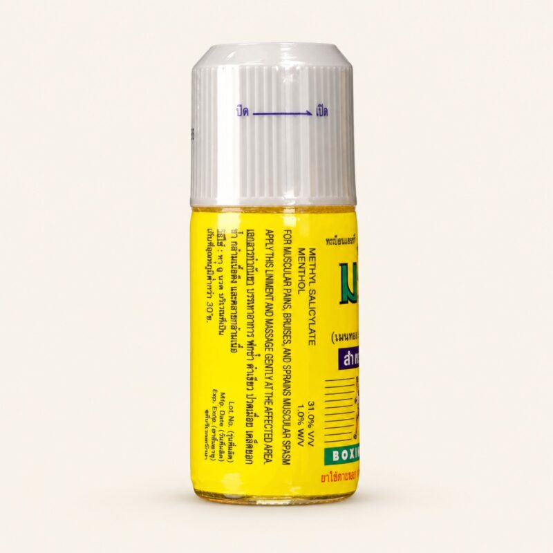 Namman Muay Thai boxing liniment oil 120 ml bottle on a warm cream background