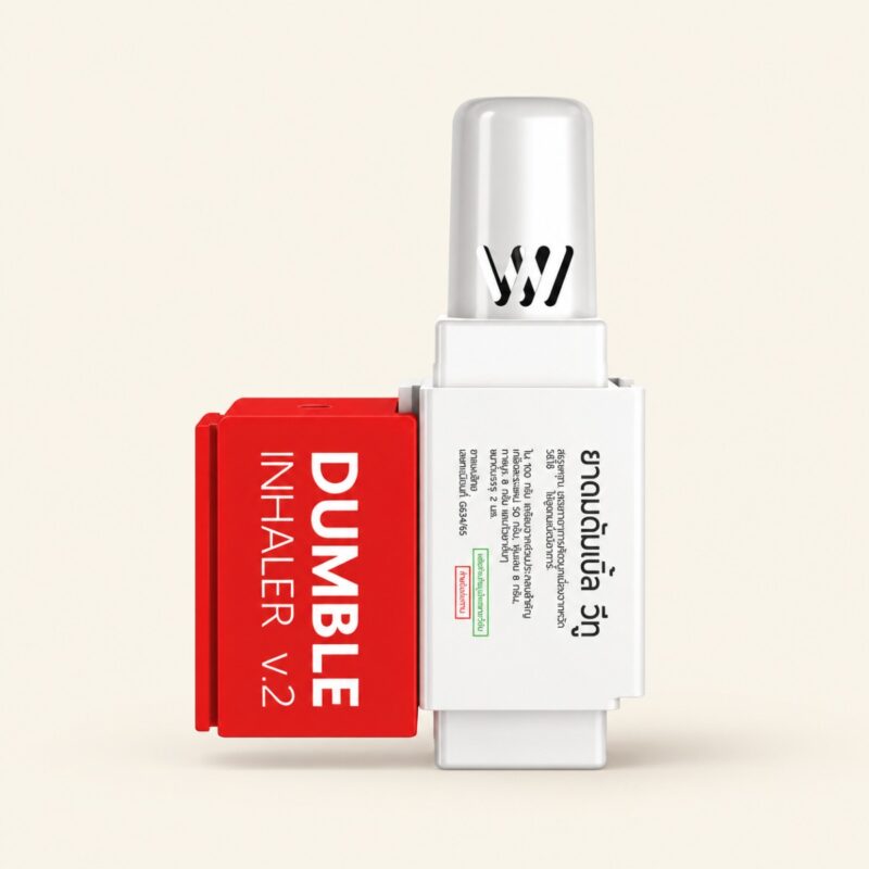 Dumble V2 dual-entry Thai herbal inhaler on a warm cream background