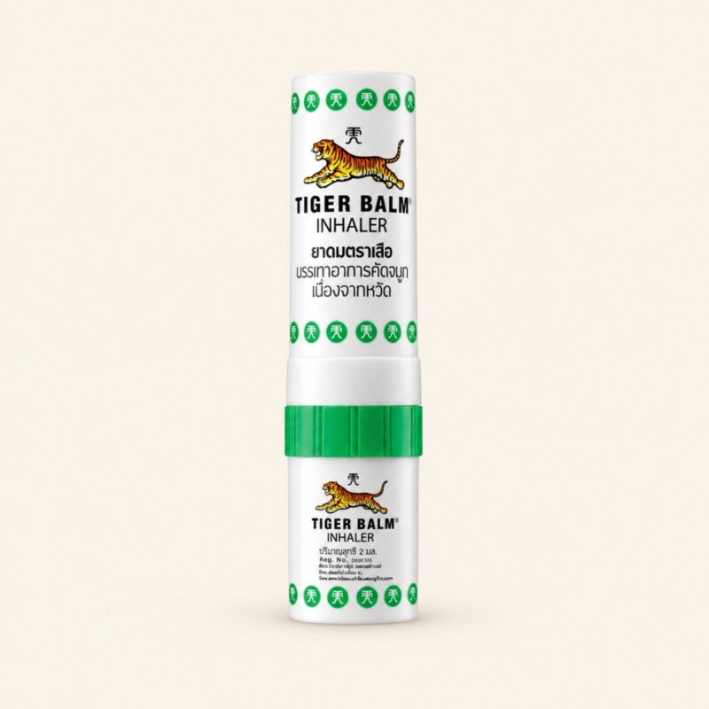 Tiger Balm two-in-one inhaler 2 ml on a warm cream background